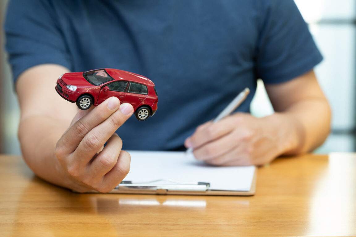 Men are choosing to buy and sign contracts policy with vehicle and car insurance, Protection of car concept